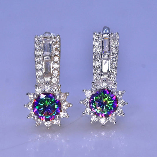 Pair of silver earrings with colorful mystic quartz on a light purple background