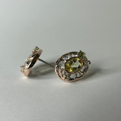 Pair of silver earrings with lemon quartz gemstones on a light gray background