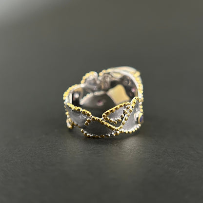 Ethiopian Opal statement ring with Rhodolite and Tanzanite support stones