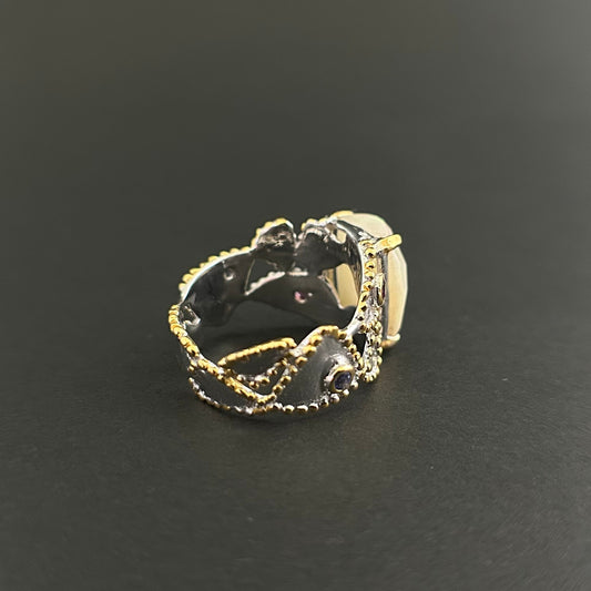 Ethiopian Opal statement ring with Rhodolite and Tanzanite support stones