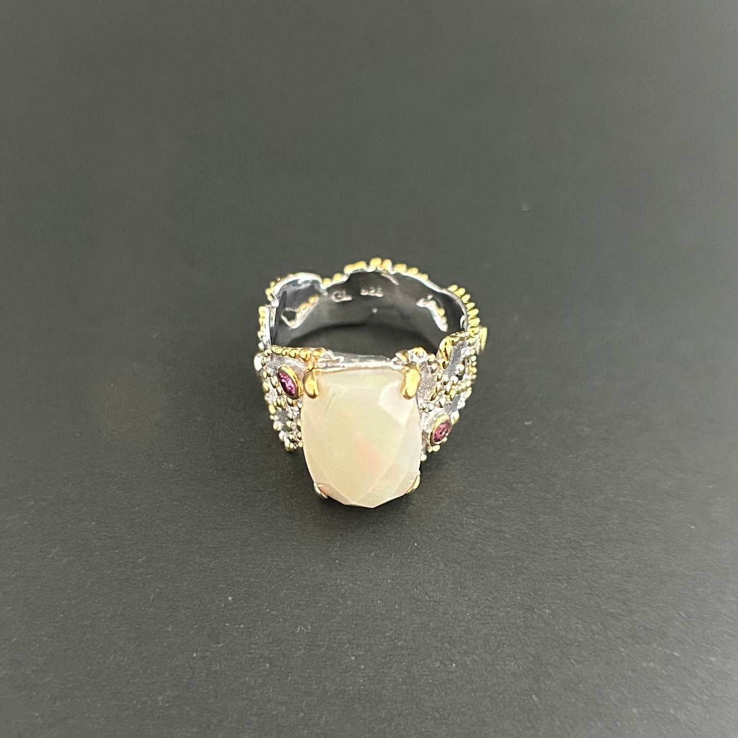 Ethiopian Opal statement ring with Rhodolite and Tanzanite support stones