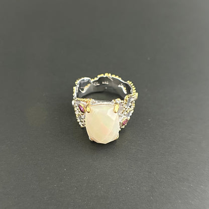 Ethiopian Opal statement ring with Rhodolite and Tanzanite support stones