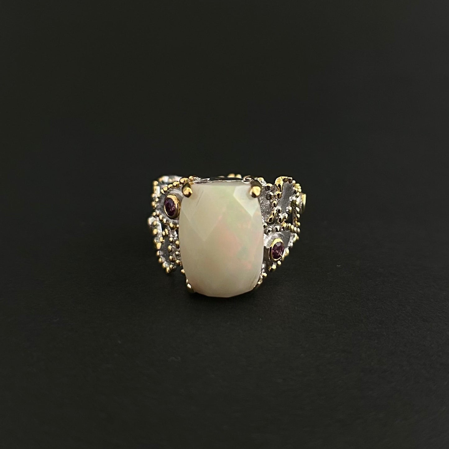 Ethiopian Opal statement ring with Rhodolite and Tanzanite support stones