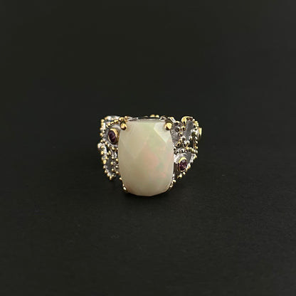 Ethiopian Opal statement ring with Rhodolite and Tanzanite support stones