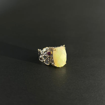 Ethiopian Opal statement ring with Rhodolite and Tanzanite support stones