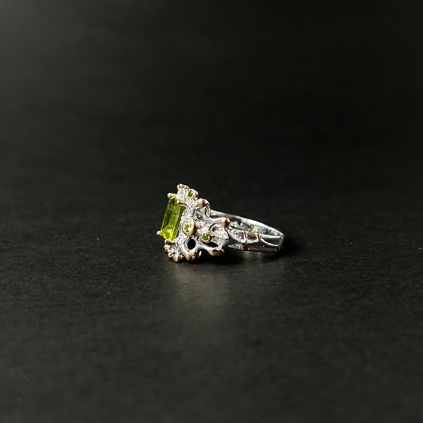 Statement ring with a luminous Peridot center stone paired with vibrant green chrome Diopside
