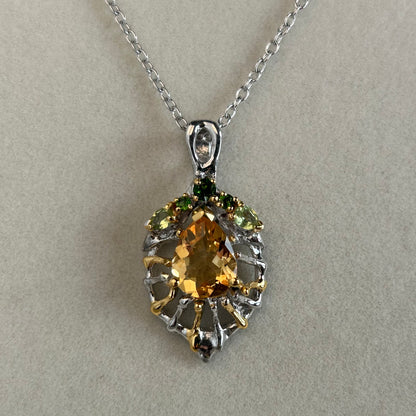 Silver Citrine pendant necklace on a light background