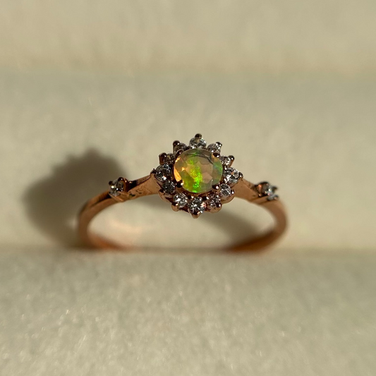Silver ring with an opal stone on a neutral background