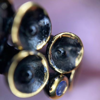 Close-up of a silver ring with gold plating.