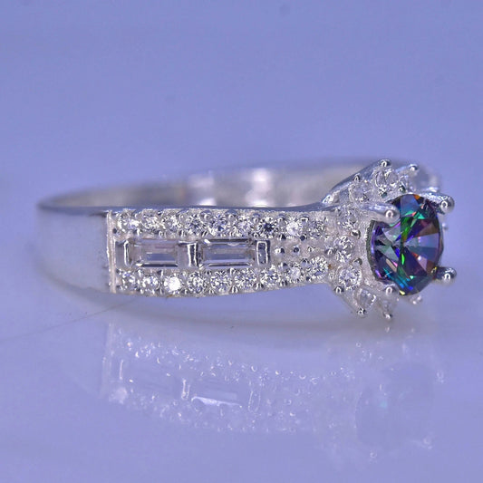 Silver ring with a colorful mystic quartz on a light purple background